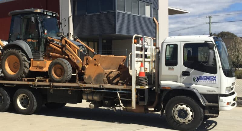 Benex backhoe and truck